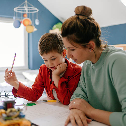 Mother homeschooling her child