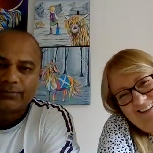 A man and woman smiling