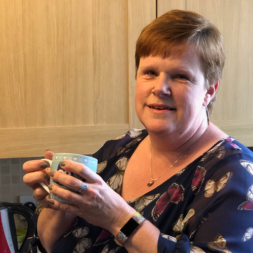 A woman holding a mug